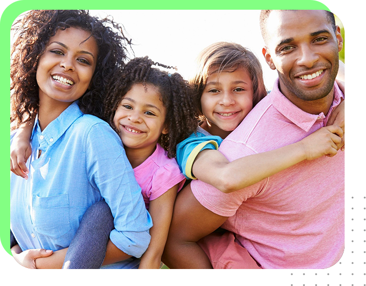 A family of four posing for the camera.