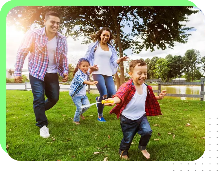 A family playing frisbee in the park